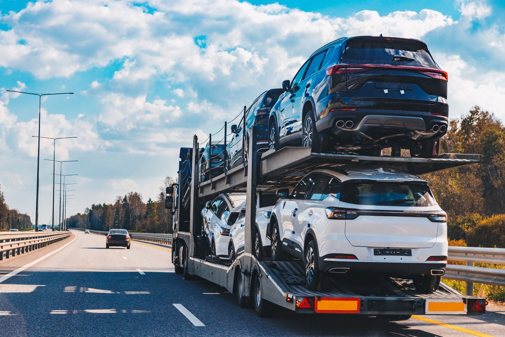 Cars being transported on a multi-level trailer by trusted vehicle transport companies